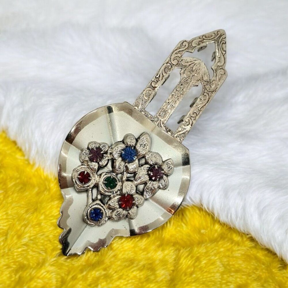 Vintage leaf dress clip Silver tone metal red and blue rhinestones